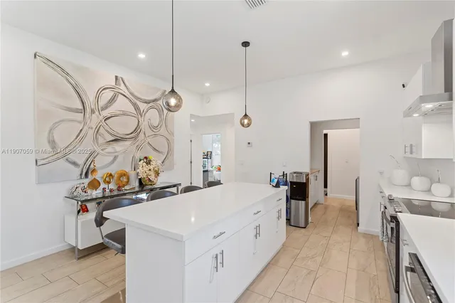 a utility room with sink dryer and washer