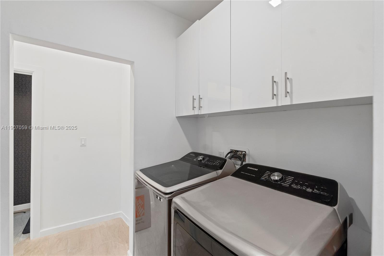 10925 Southwest 218th Terrace Miami, FL 33170 - Photo 18 of 32 a utility room with dryer and washer