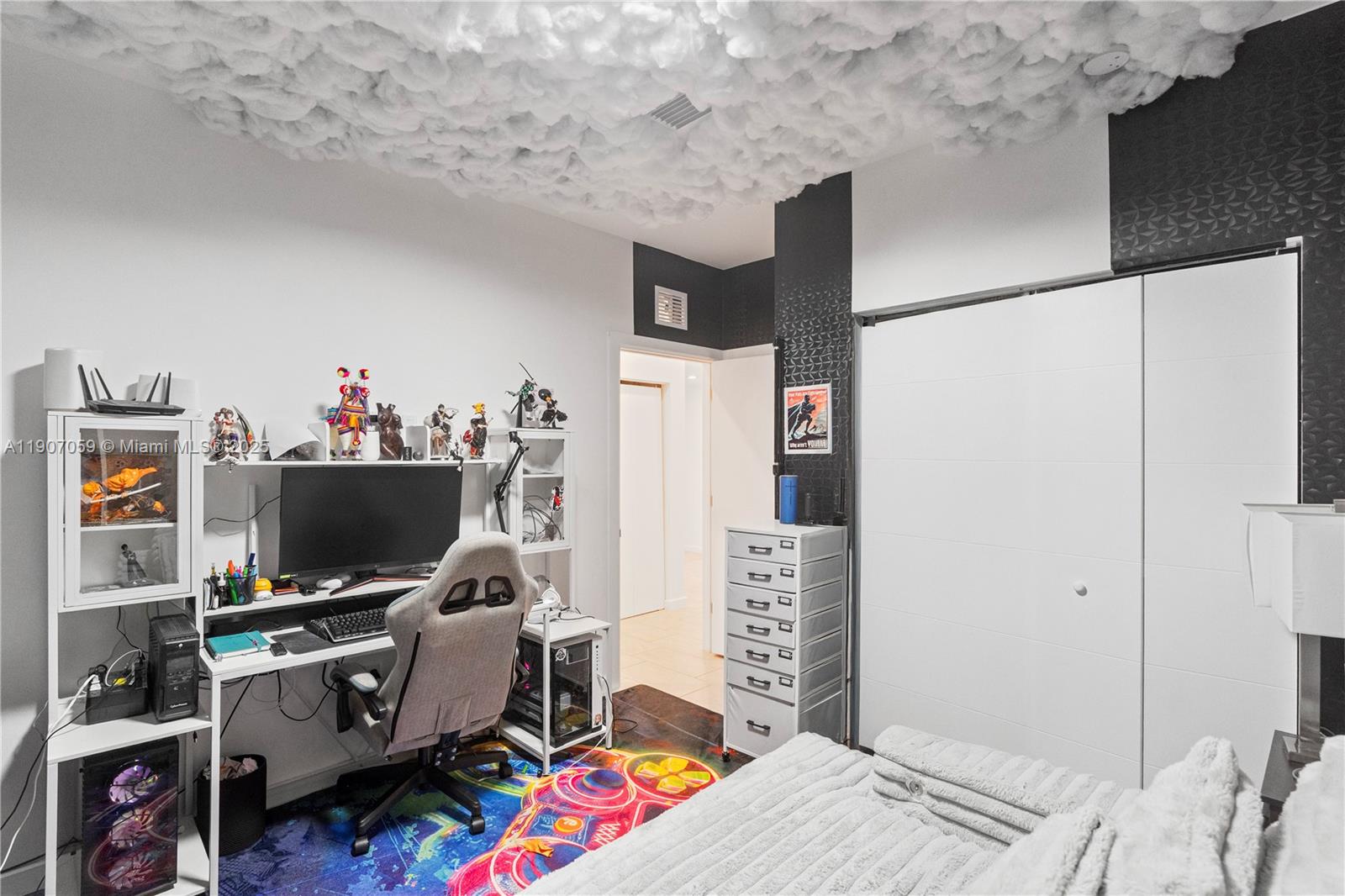 10925 Southwest 218th Terrace Miami, FL 33170 - Photo 20 of 32 a bedroom with a bed and a flat screen tv