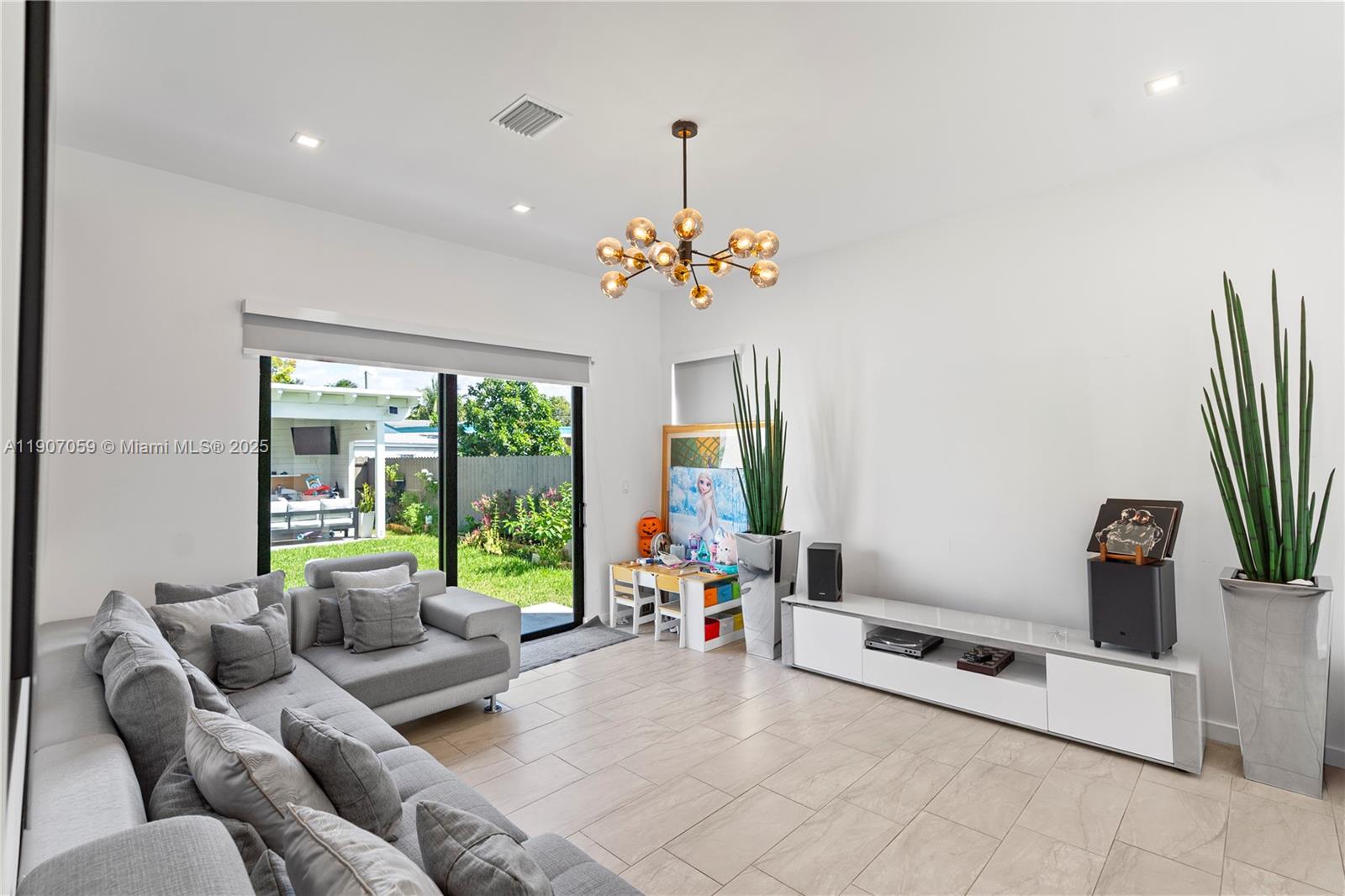 10925 Southwest 218th Terrace Miami, FL 33170 - Photo 21 of 32 a living room with furniture and a large window