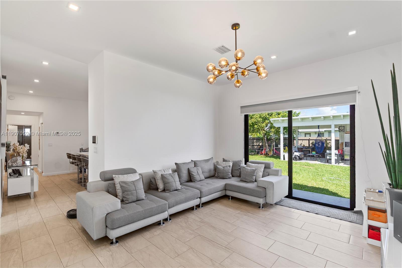 10925 Southwest 218th Terrace Miami, FL 33170 - Photo 22 of 32 a living room with furniture and a large window