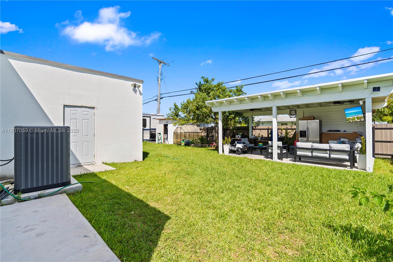 10925 Southwest 218th Terrace Miami, FL 33170 - Photo 24 of 32 a view of a house with backyard and porch