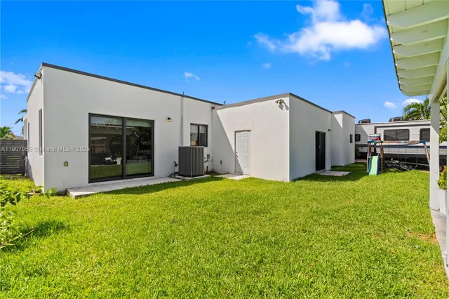 a kitchen with stainless steel appliances a stove a microwave and wood floor