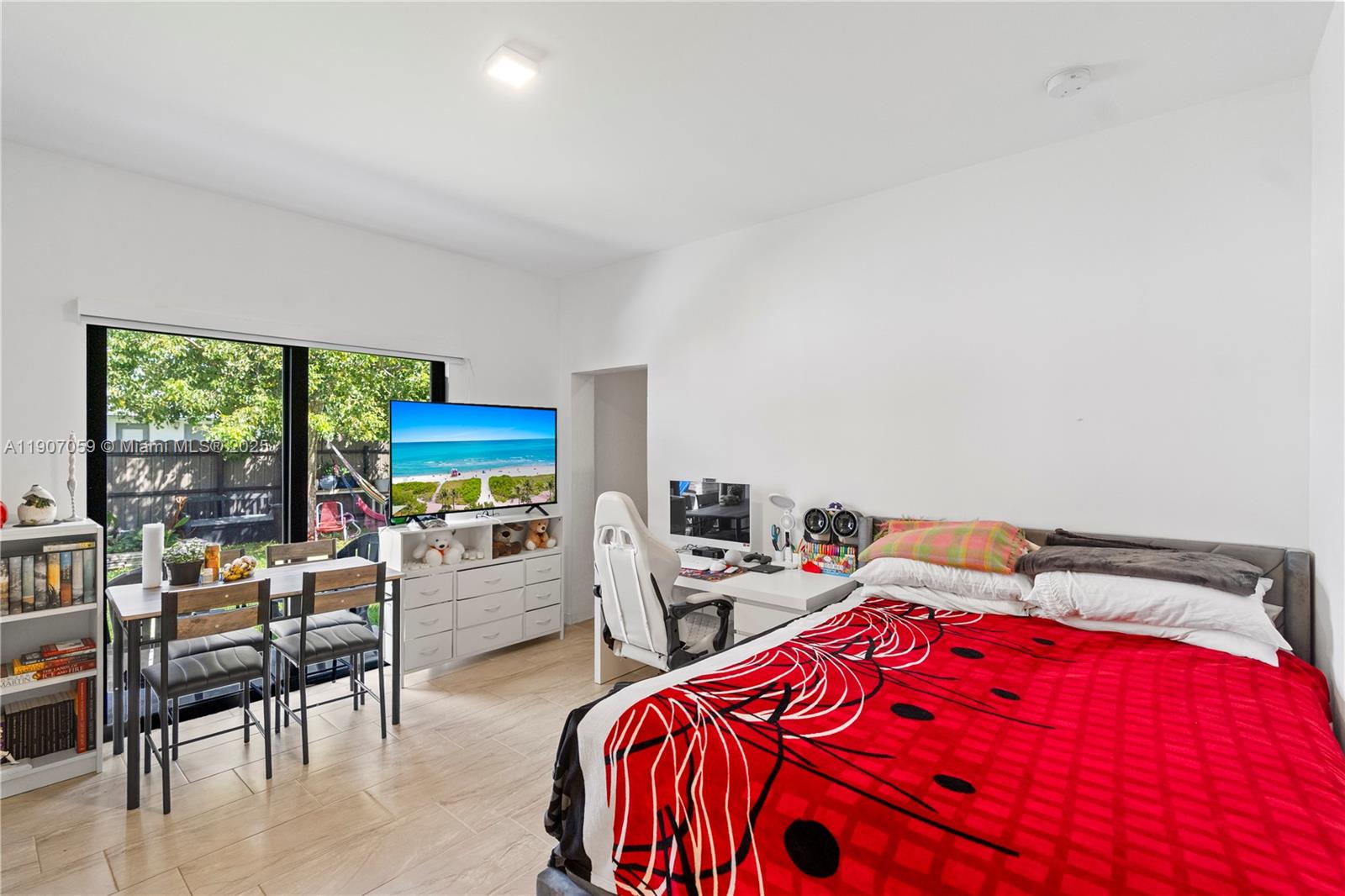 10925 Southwest 218th Terrace Miami, FL 33170 - Photo 29 of 32 a bedroom with furniture and a flat screen tv