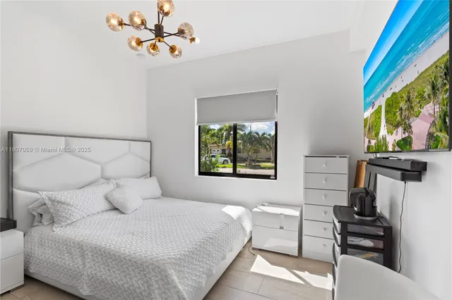 a bedroom with a bed and a walk in closet