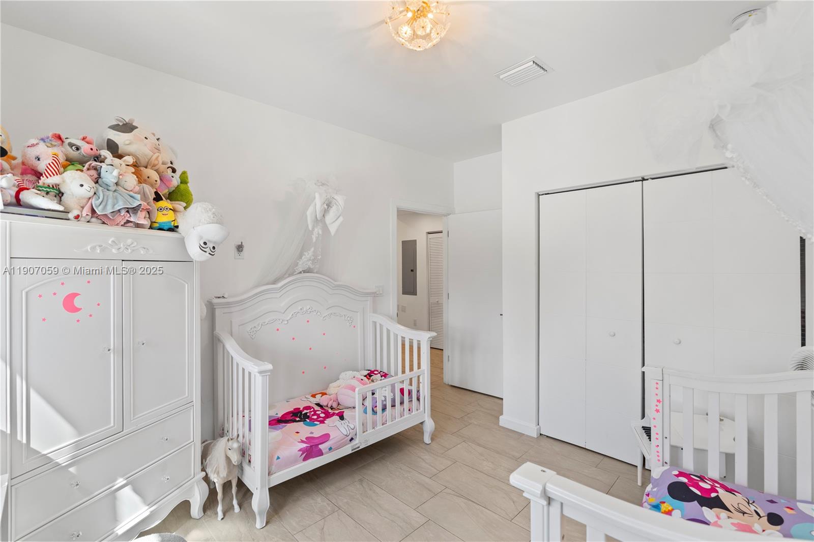 10925 Southwest 218th Terrace Miami, FL 33170 - Photo 10 of 32 a bedroom with baby toys