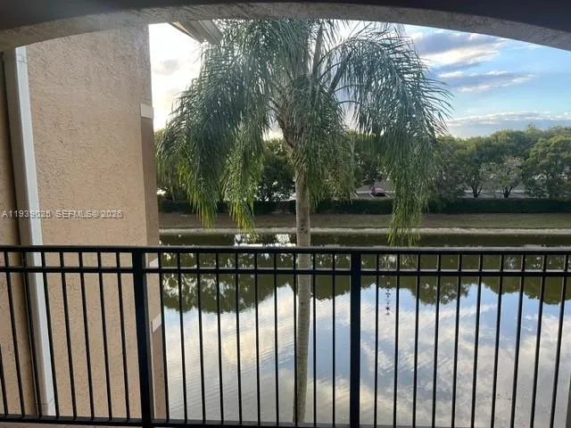 a view of wooden fence and lake