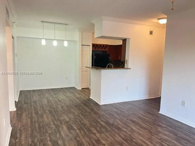 a view of a livingroom with wooden floor