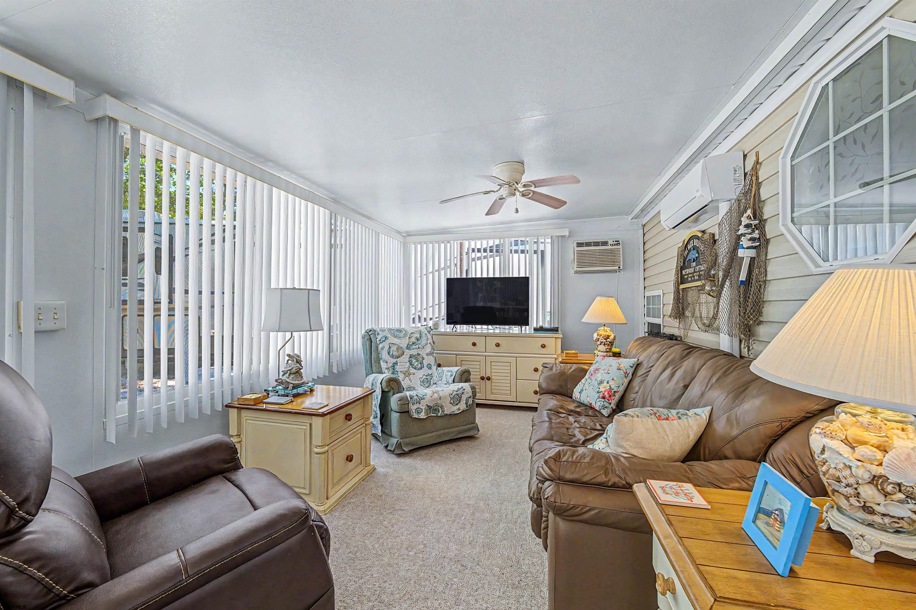 3066 Route 9 Ocean View, NJ 08230 - Photo 9 of 29 a living room with furniture and a flat screen tv