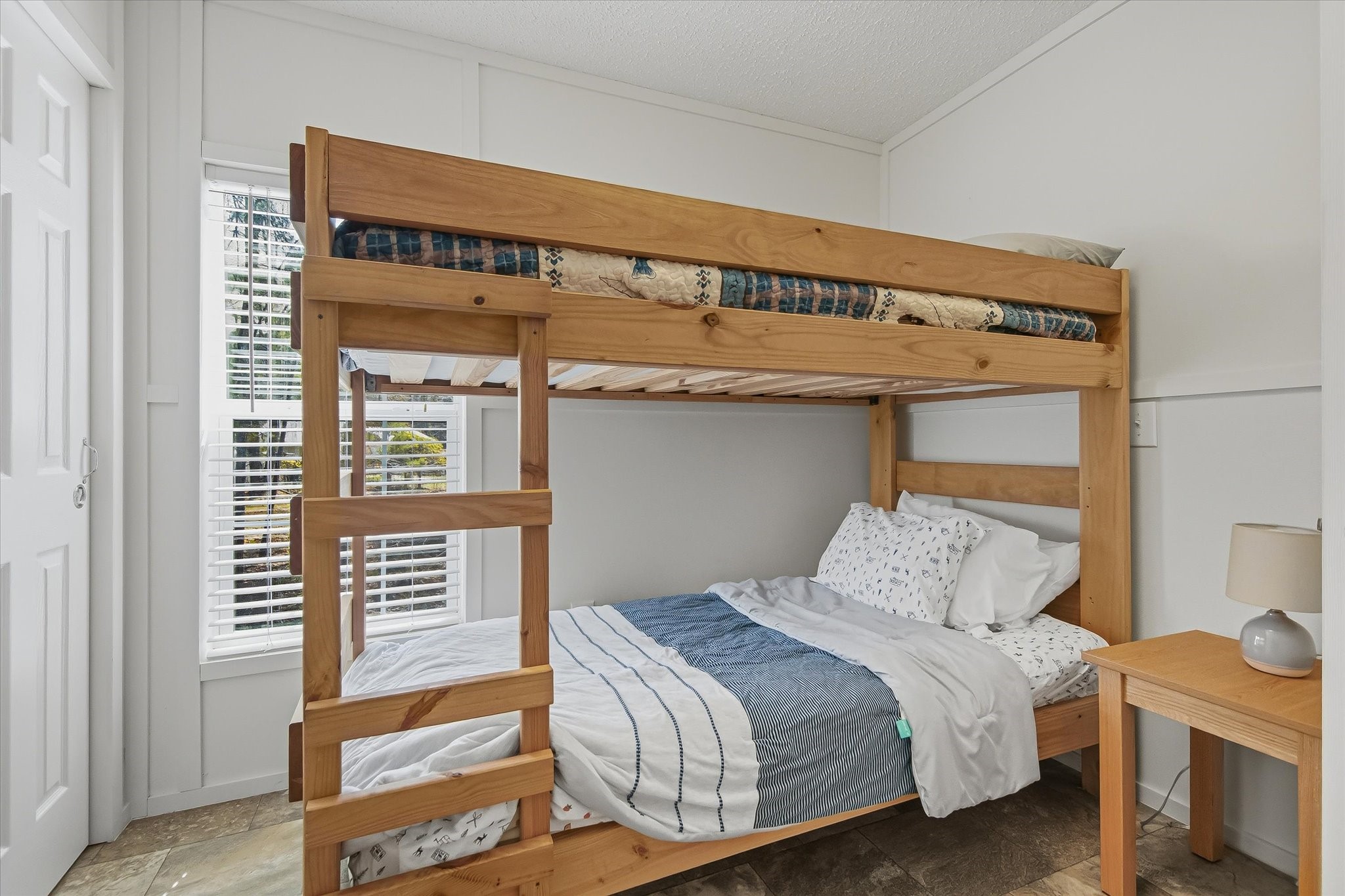 180 Elm Trail Trinity, TX 75862 - Photo 19 of 44 a bedroom with a bed and a window