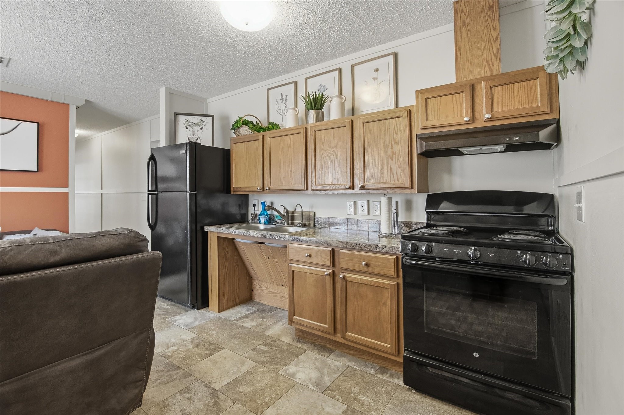 180 Elm Trail Trinity, TX 75862 - Photo 10 of 44 a kitchen with stainless steel appliances granite countertop a refrigerator stove and sink