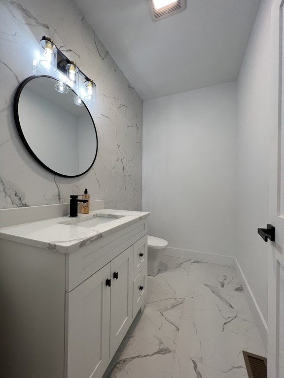 47 Stratton Farms Road Suffield, CT 06093 - Photo 17 of 28 a bathroom with a toilet sink and mirror