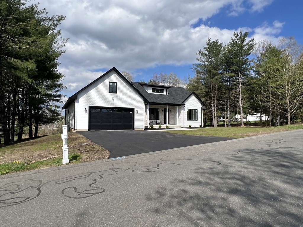 47 Stratton Farms Road Suffield, CT 06093 - Photo 2 of 28 a front view of a house with a yard and garage