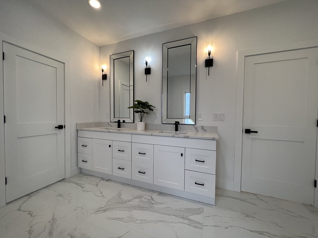 47 Stratton Farms Road Suffield, CT 06093 - Photo 21 of 28 a bathroom with a granite countertop sink mirror and shower