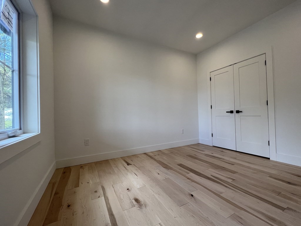 47 Stratton Farms Road Suffield, CT 06093 - Photo 23 of 28 a view of wooden floor in an empty room