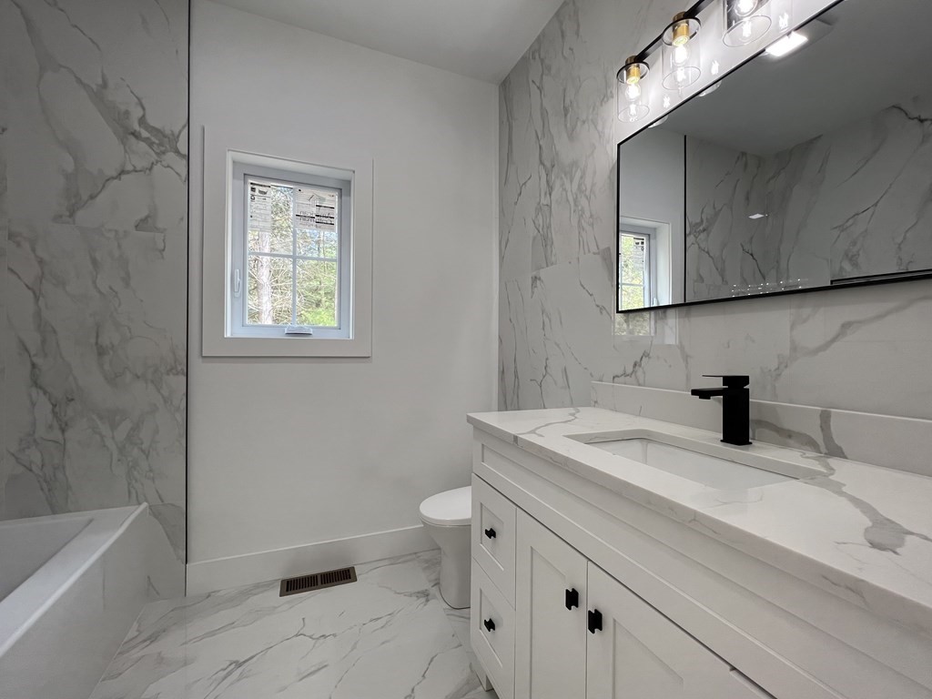 47 Stratton Farms Road Suffield, CT 06093 - Photo 24 of 28 a bathroom with a sink a toilet and bathtub