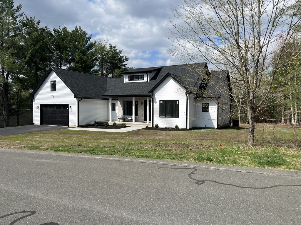 47 Stratton Farms Road Suffield, CT 06093 - Photo 3 of 28 a front view of a house with a yard and garage
