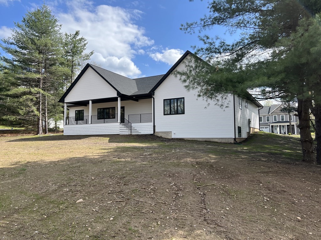 47 Stratton Farms Road Suffield, CT 06093 - Photo 6 of 28 a front view of a house with a yard and garage