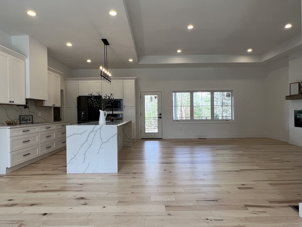 47 Stratton Farms Road Suffield, CT 06093 - Photo 9 of 28 a large kitchen with kitchen island a sink stainless steel appliances and cabinets