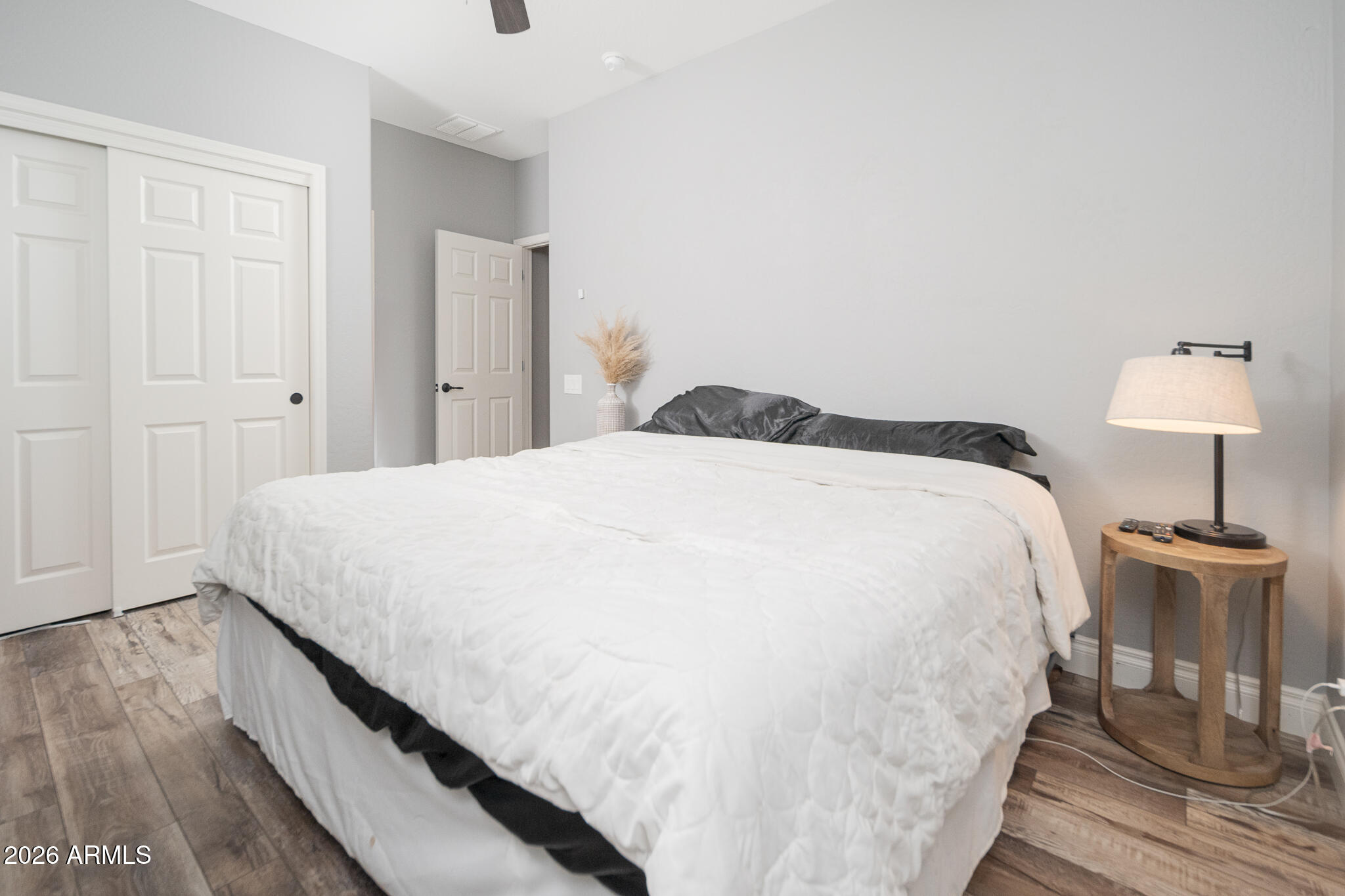 10789 West Yearling Road Peoria, AZ 85383 - Photo 15 of 35 a spacious bedroom with a bed and a table