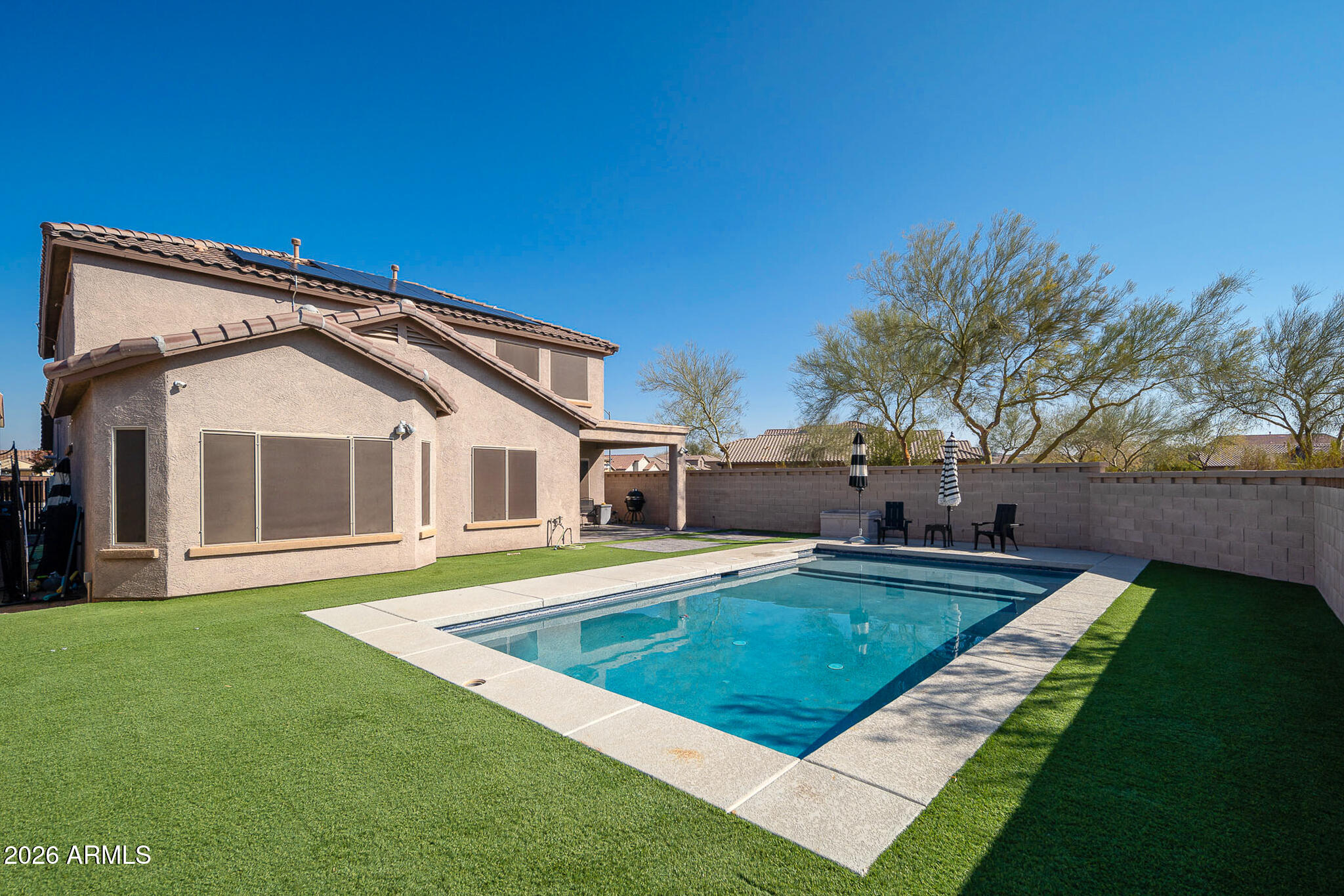 10789 West Yearling Road Peoria, AZ 85383 - Photo 22 of 35 a front view of a house with garden
