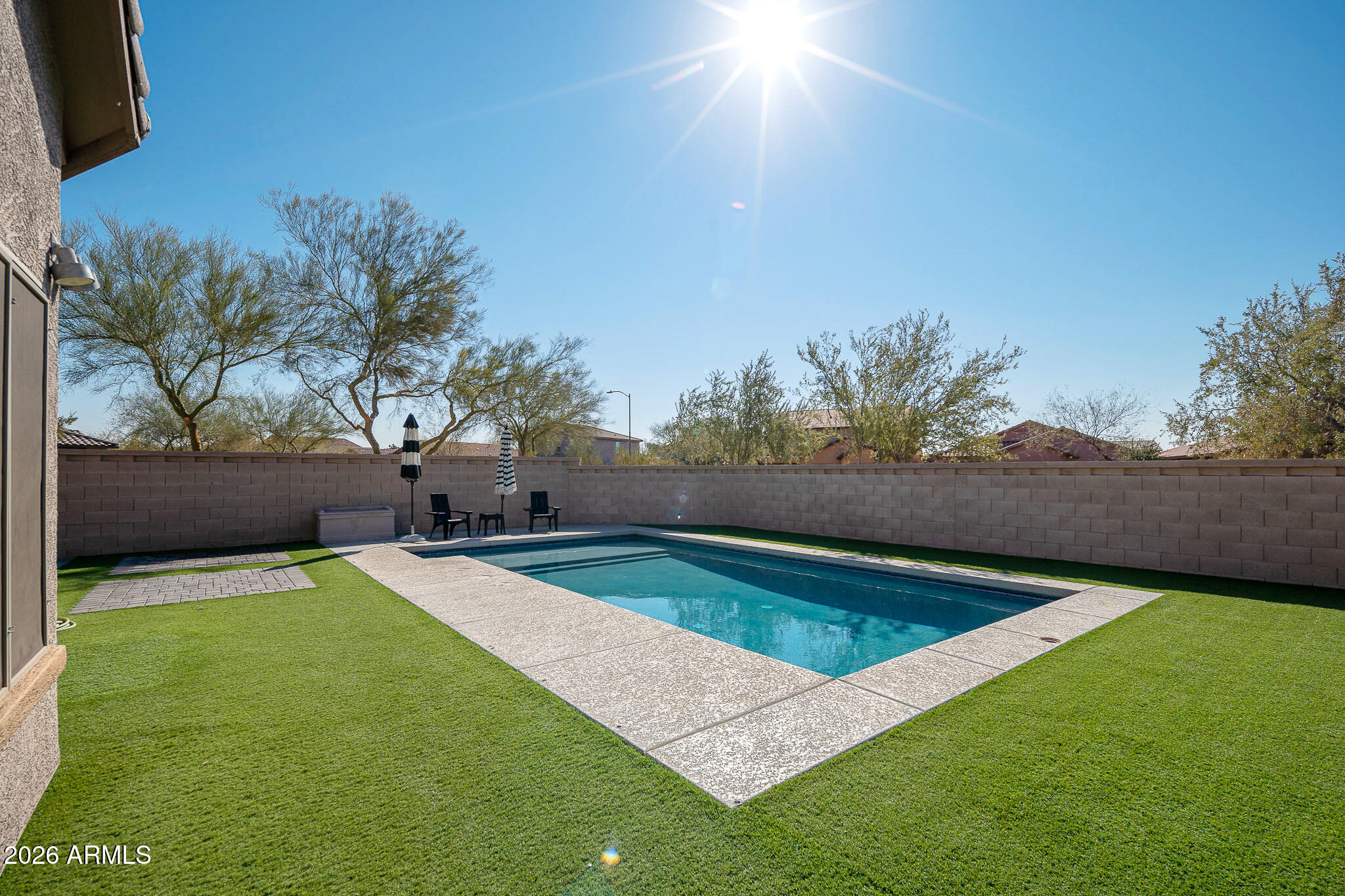 10789 West Yearling Road Peoria, AZ 85383 - Photo 24 of 35 a view of a backyard with swimming pool