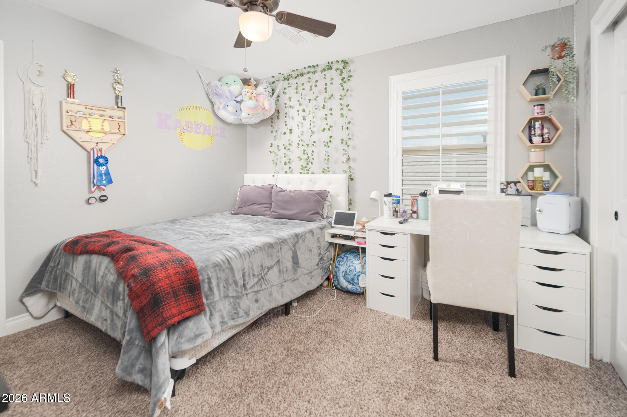 10789 West Yearling Road Peoria, AZ 85383 - Photo 7 of 35 a bedroom with a bed and a chandelier