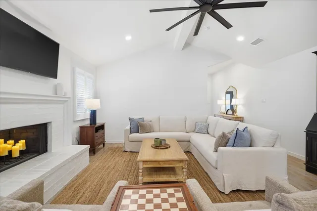 a kitchen with stainless steel appliances granite countertop a table chairs sink and cabinets