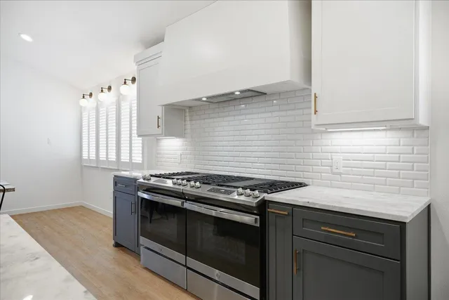 a view of a dining room with furniture and window