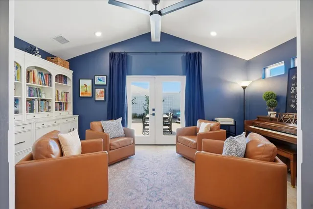a living room with furniture dining area and a painting