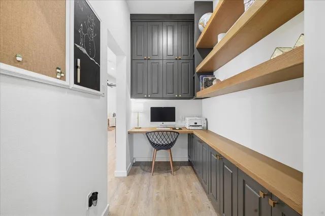a bathroom with a sink a toilet and a large mirror