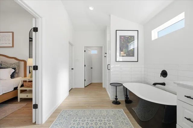 a bedroom with a bed and a sink