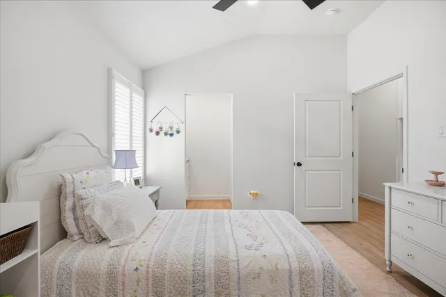 a bedroom with furniture and a wooden floor