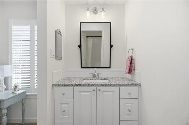 a bedroom with furniture and a book shelf
