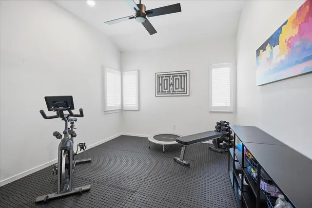 a view of a balcony with furniture and a potted plant