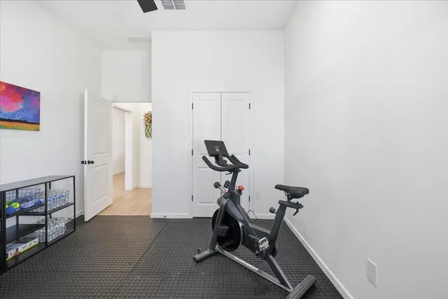 a living room with furniture rug and wooden floor