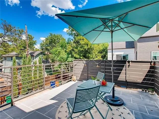 a patio with tables and chairs