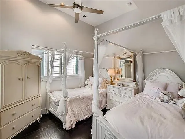 a bedroom with bed and window