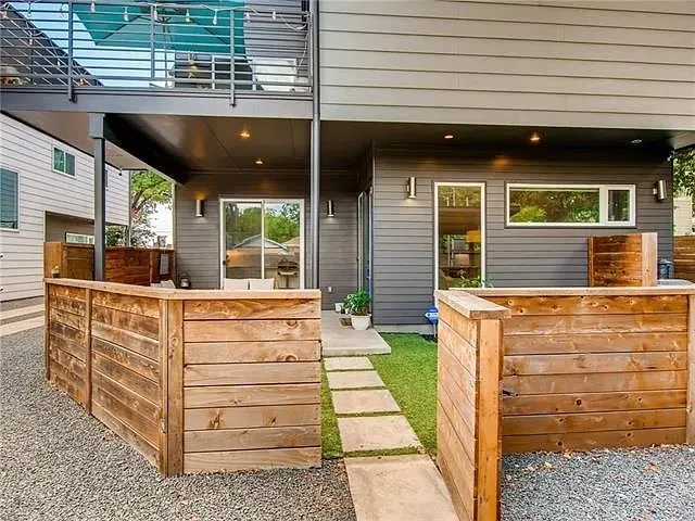 a balcony with furniture and potted plants