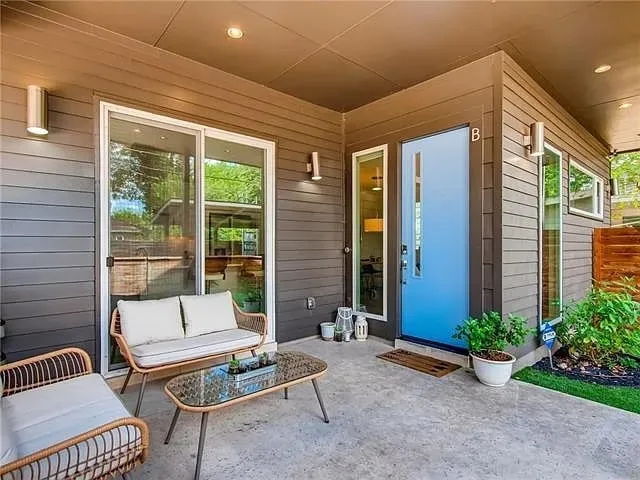 a outdoor living space with patio furniture and a window