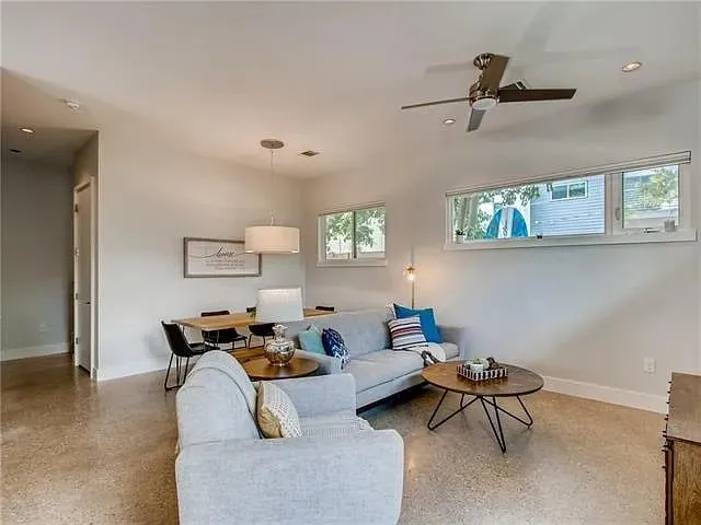 a living room with furniture and a window