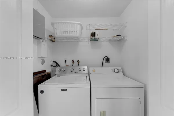 a utility room with dryer and washer