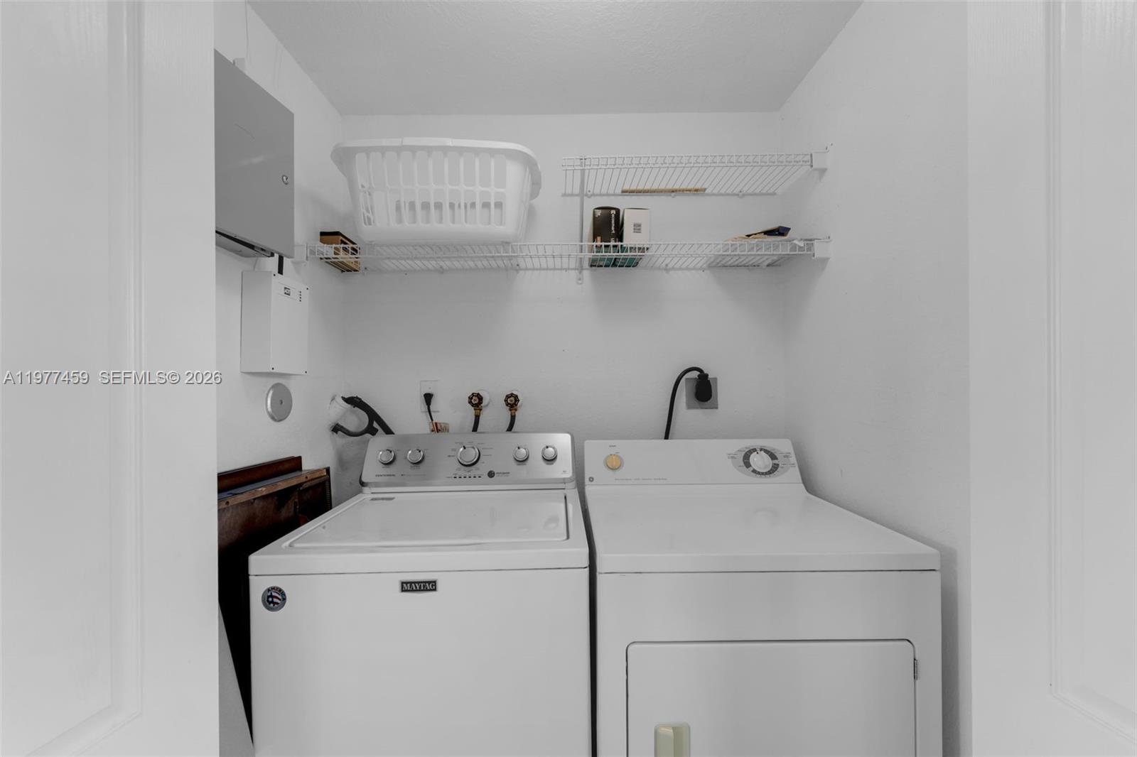 17040 Southwest 137th Place Miami, FL 33177 - Photo 20 of 29 a utility room with dryer and washer
