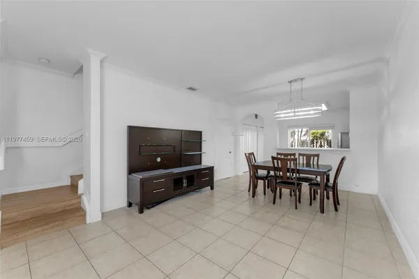 a view of a livingroom with furniture and chandelier