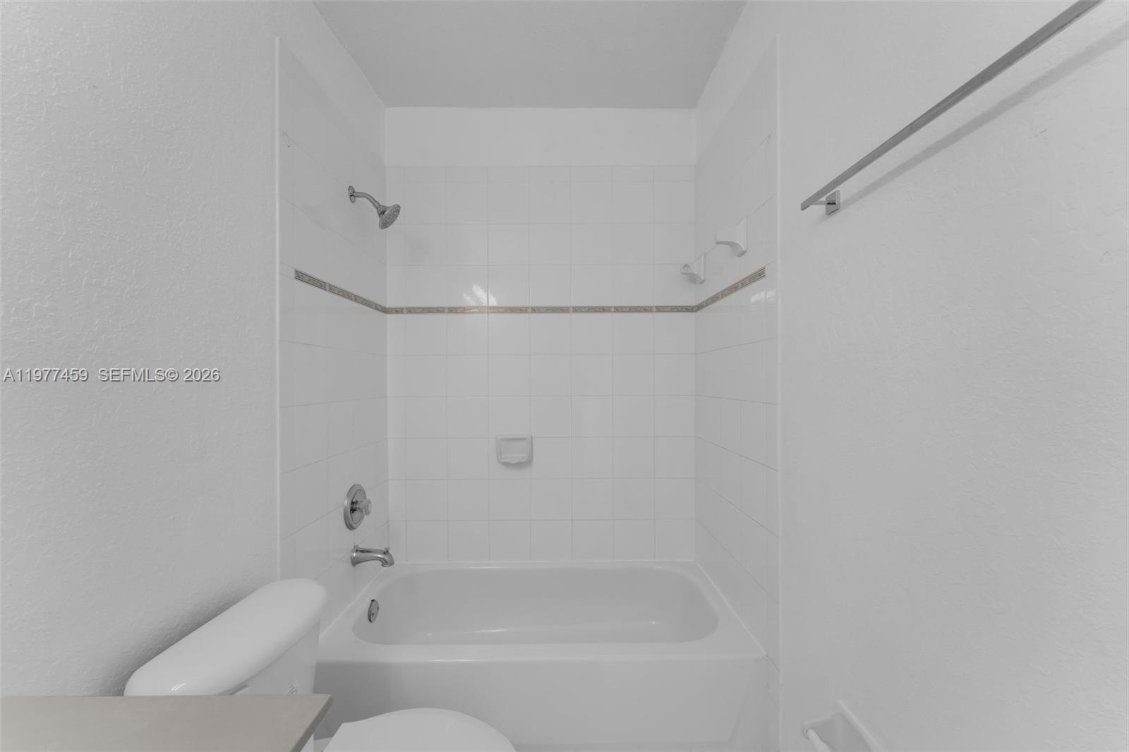 17040 Southwest 137th Place Miami, FL 33177 - Photo 10 of 29 a bathroom with a bathtub and a shower