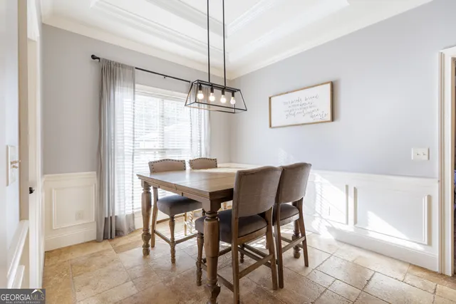 a bedroom with a bed a couch and a ceiling fan