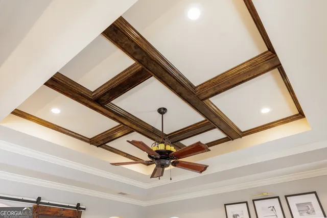 a living room with furniture a chandelier and a window