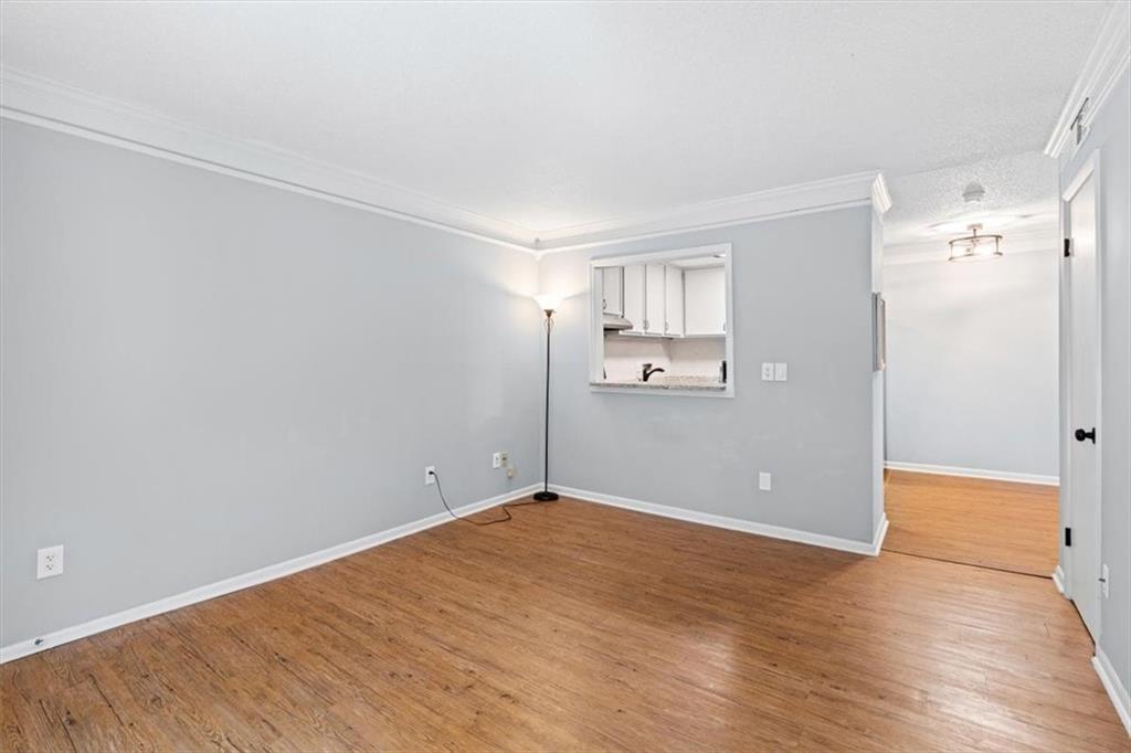 1225 Church Street, Unit J Decatur, GA 30030 - Photo 3 of 27 a view of empty room with wooden floor