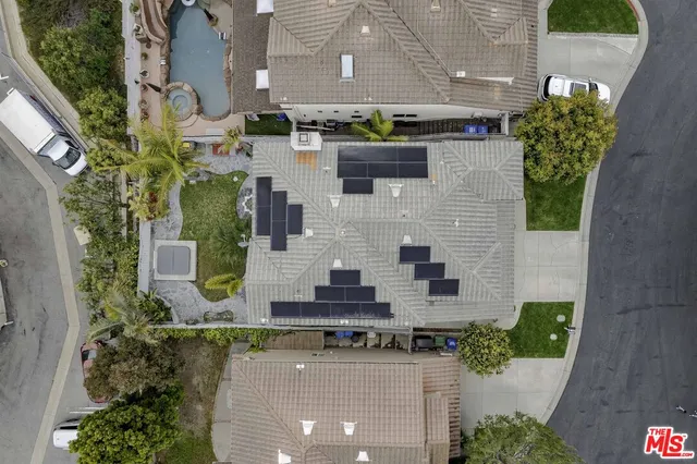 an aerial view of a house with outdoor space