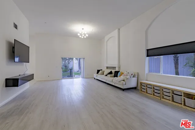 a view of a backyard with potted plants